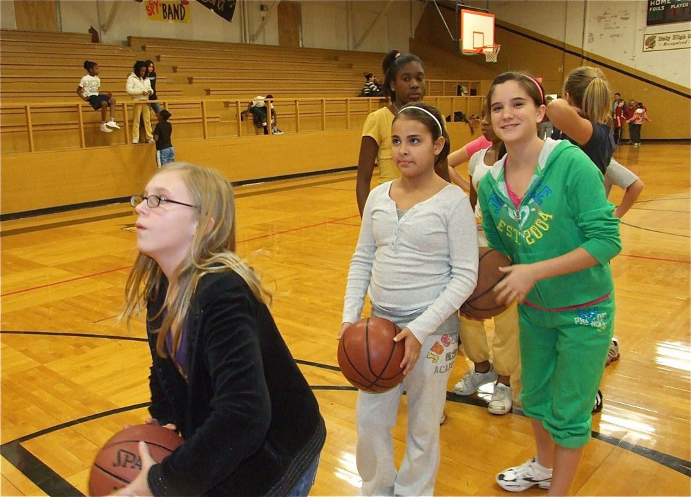 Image: Jen from the line — Jennifer McDaniel prepares to shoot while Ashlyn Jacinto, Cassity Childers and Janae Robertson wait their turn.