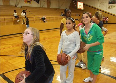 Image: Jen from the line — Jennifer McDaniel prepares to shoot while Ashlyn Jacinto, Cassity Childers and Janae Robertson wait their turn.