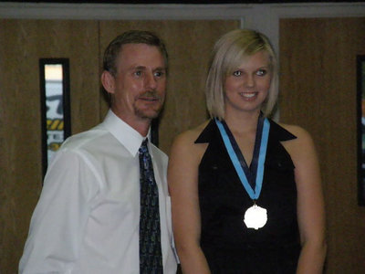 Image: Megan Hopkins — Principal Scott Herald presents Megan with her medal.