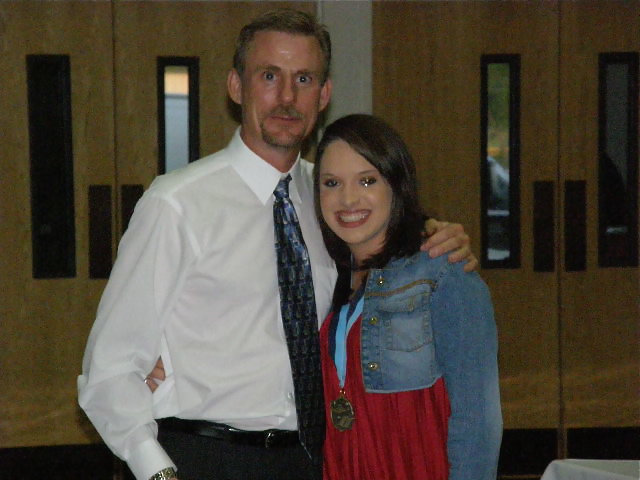 Image: Kelli Strickland — Kelli receives her second year award from Mr. Herald.