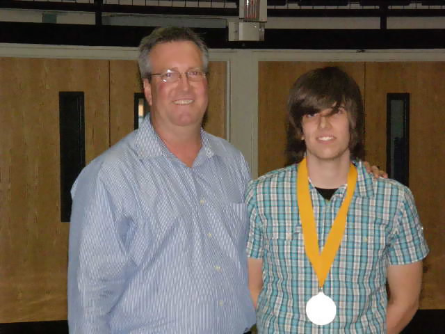 Image: Proud Papa — Mike Vlk and his father relish the moment.