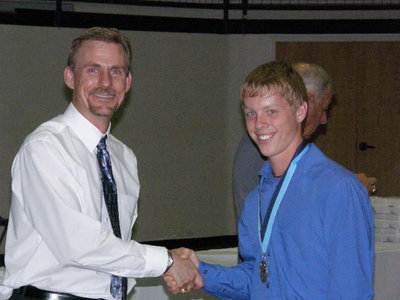 Image: Josh Milligan — Josh receives his second year honors from Mr. Herald.