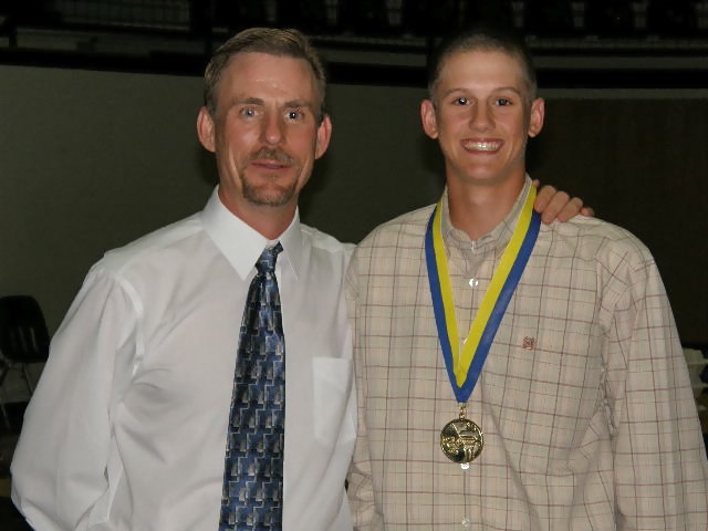 Image: Holden holds back — Jase Holden fights back the tears as Principal Herald honors him with a medal for being way, way, way above average! Nice job, Jase.