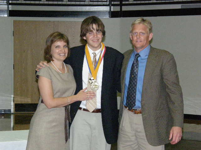 Image: The Boyd’s Celebrate — Ricky and Monica Boyd enjoy the Valedictorian award with their son, Tyler.