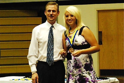 Image: Megan Richards shines — Megan accepts her Academic Medal from Principal Scott Herald during the Italy High School Academic banquet.