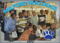 Image: Members of the Milford Bulldog Football Team huddle at the banquet — The Milford Bulldogs received honors and feasted at their athletic banquet Tuesday. Only they didn’t chomp on eagles and panthers, as they did during the sports year, this time they had brisket and sausage.