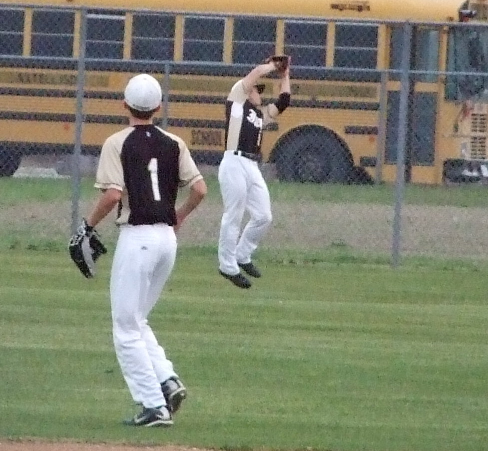 Image: Yeah, he got it — Ethan Simon jumped and caught the fly out hit by a Longhorn.