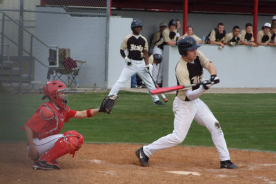 Image: Kyle at bat — Kyle Wilkins get a base hit.