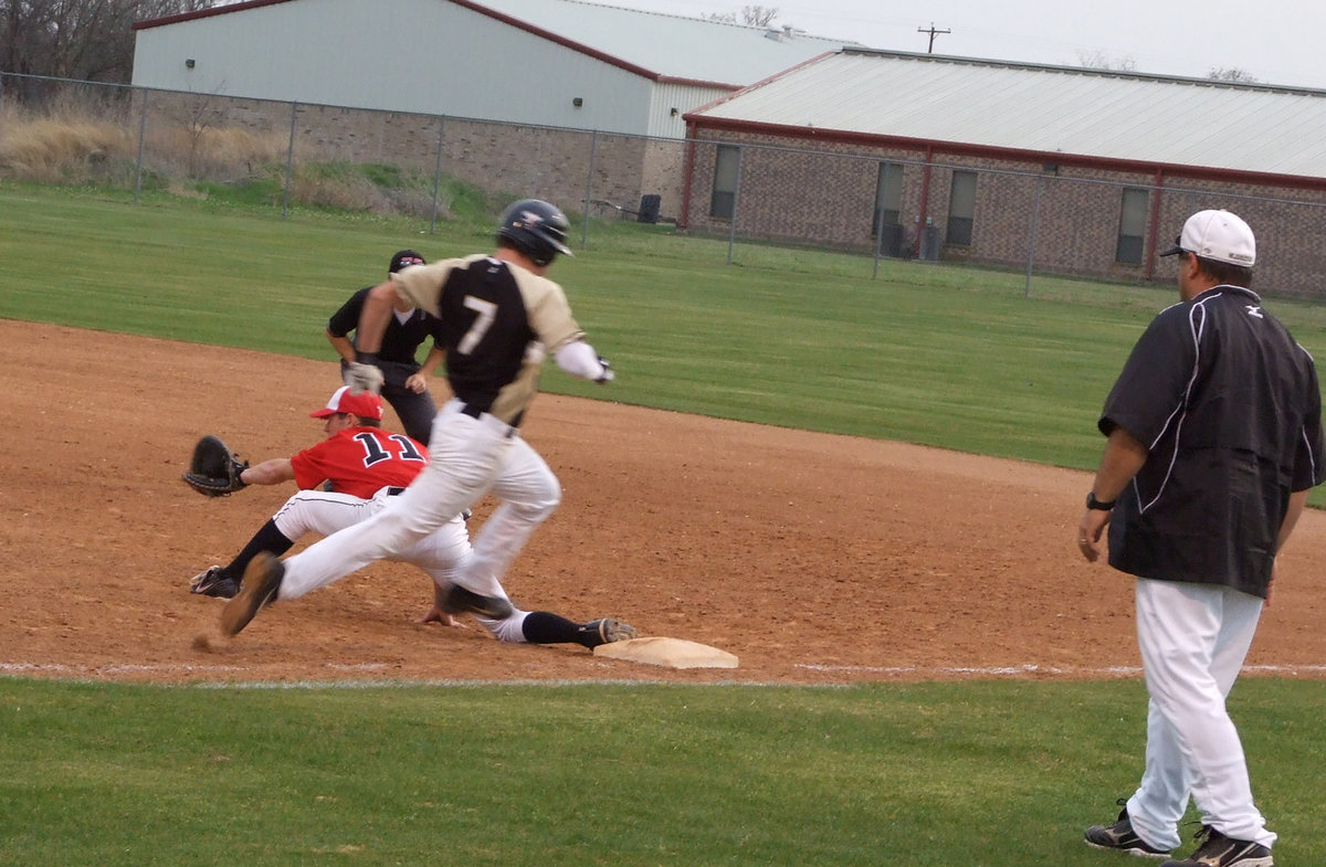 Image: Makes it — Wilkens takes his long strides and makes it to first.