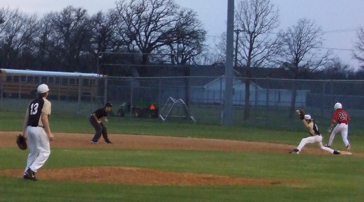 Image: He’s out — Campbell has this Longhorn out at first.