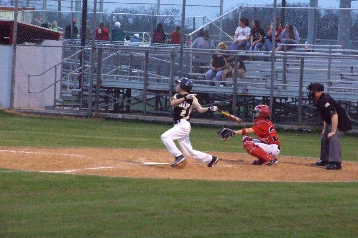 Image: Caden Jacinto sends it — Caden hits this one at the first district game.