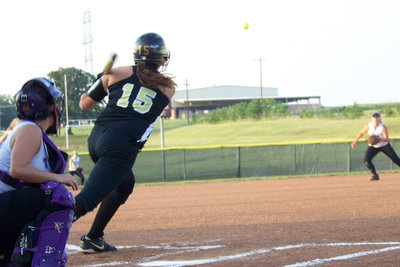 Image: What a shot! — Cori Jeffords hits a shot to the outfield.