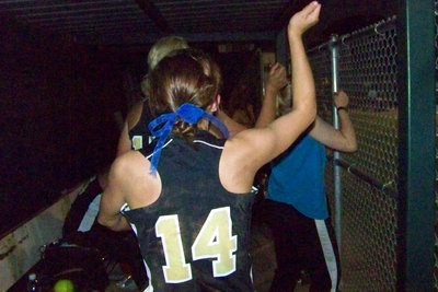 Image: Lively dugout — The Ladies start their celebration early.