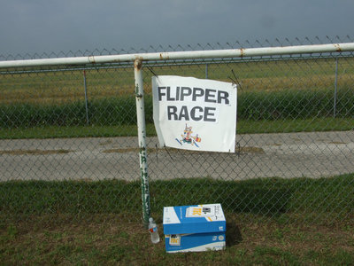 Image: Flipper Race — Wearing flippers on their feet students were asked to run as quickly as they could.
