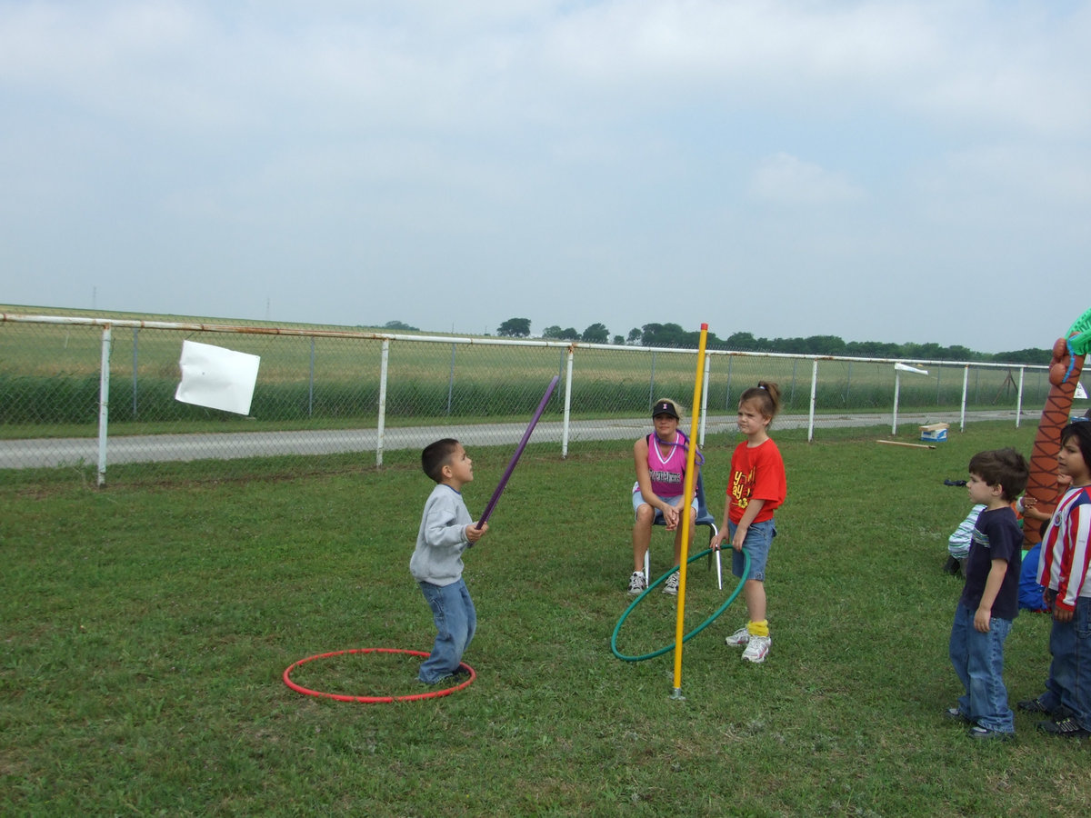 Image: Ring Toss — How many rings will he get on the pole?