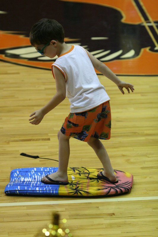 Image: Surfs Up, Dude! — Surfing along Eagle Beach during the Avalon Elementary Talent Show.