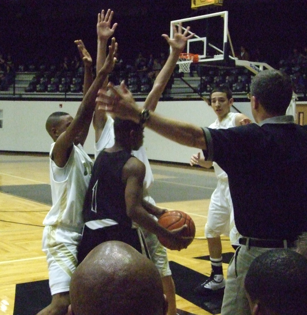 Image: Coach lends a hand — Thanks to Head Coach Kyle holley, the Gladiators have this Dallas Faith player completely surrounded.