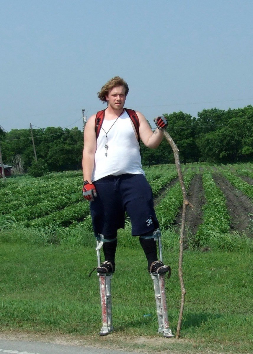 Image: Man on Stilts — David Horner practicing walking on stilts for his job at Screams Halloween Theme Park.