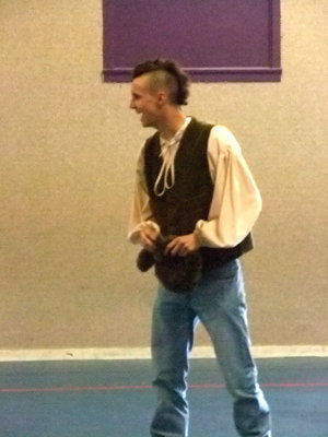 Image: Almost scalped. — Davy Crockett (Brandon Williams) told the students how the indians wanted to scalp him.