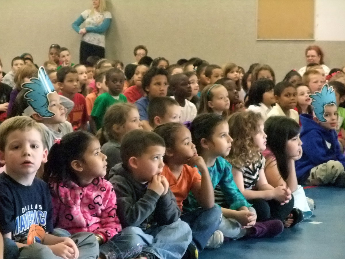 Image: Wrapped up in the skit — These students were intently listening to Stephen F. Austin.