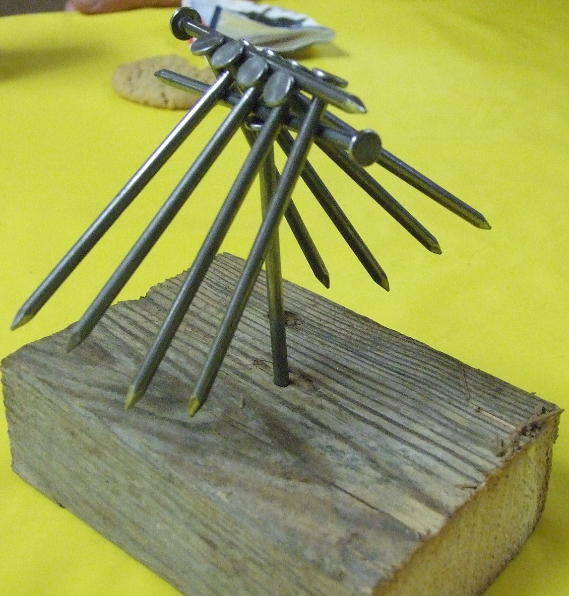 Image: Balanced nails — Can you balance ten 16 penny nails on the head of another?  Brother Walter Buchanan of Italy Church of Christ can.