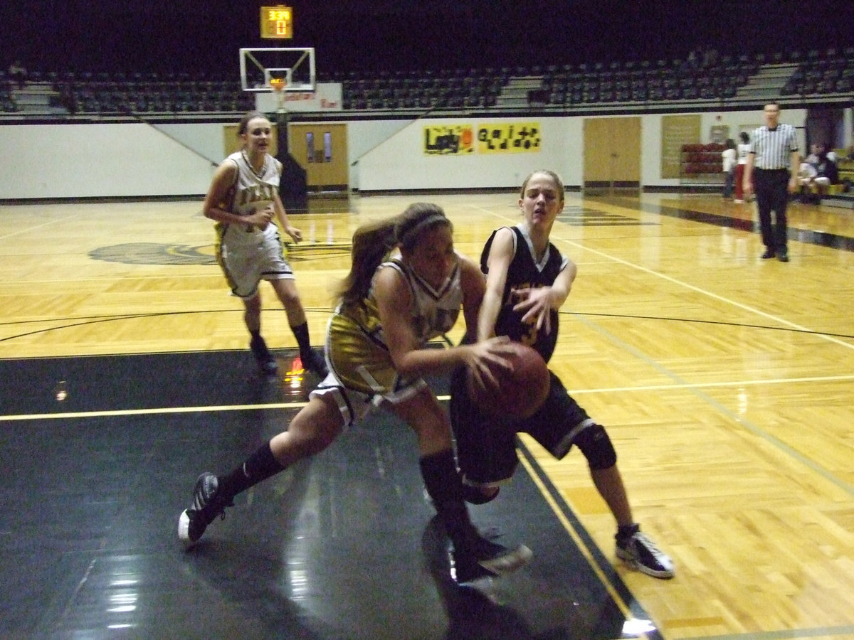 Image: Richards battles — Italy’s Alyssa Richards is the enforcer for the Girls 8th grade squad providing the attitude as she rips this ball away from an Itasca player.