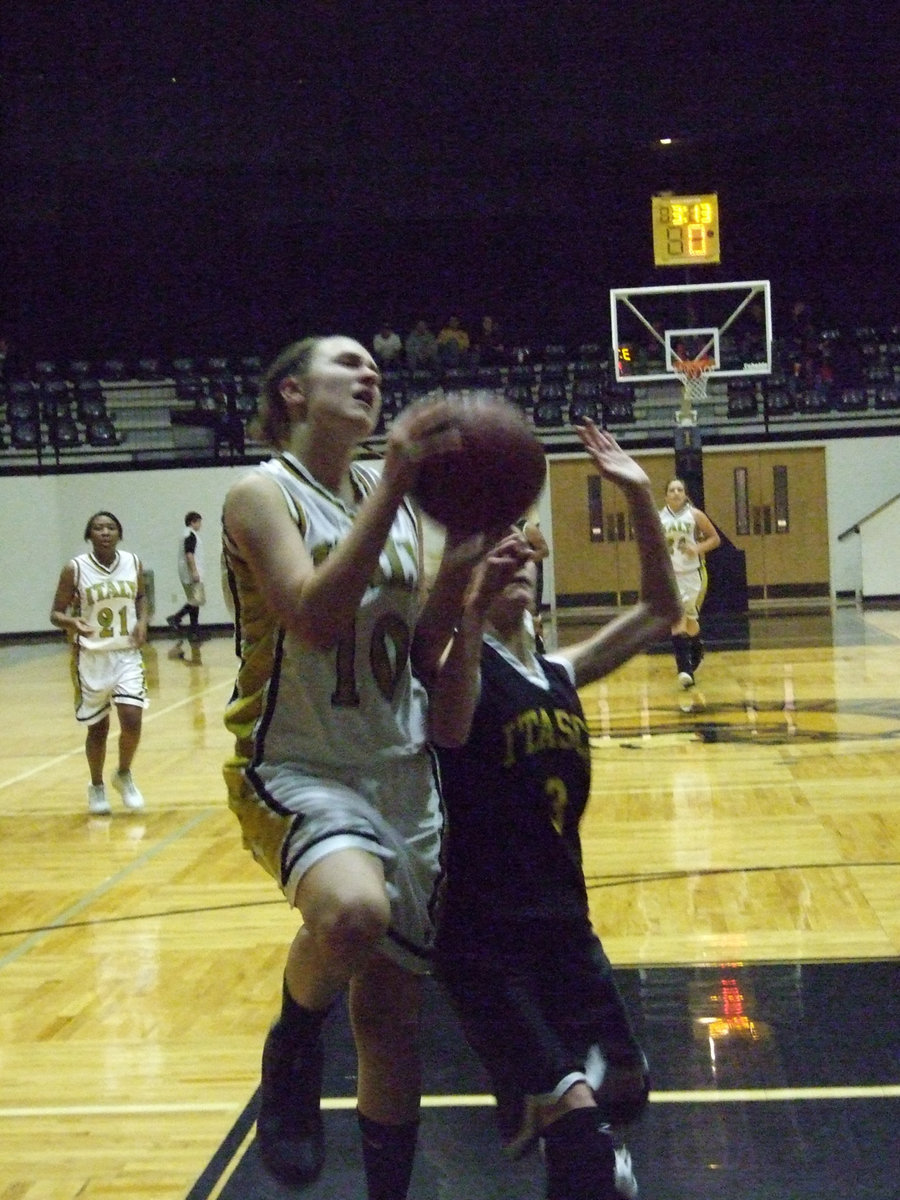 Image: Perry’s fouled hard — Italy’s #10 Brianna Perry gets fouled hard and is hurled into photograhers row.