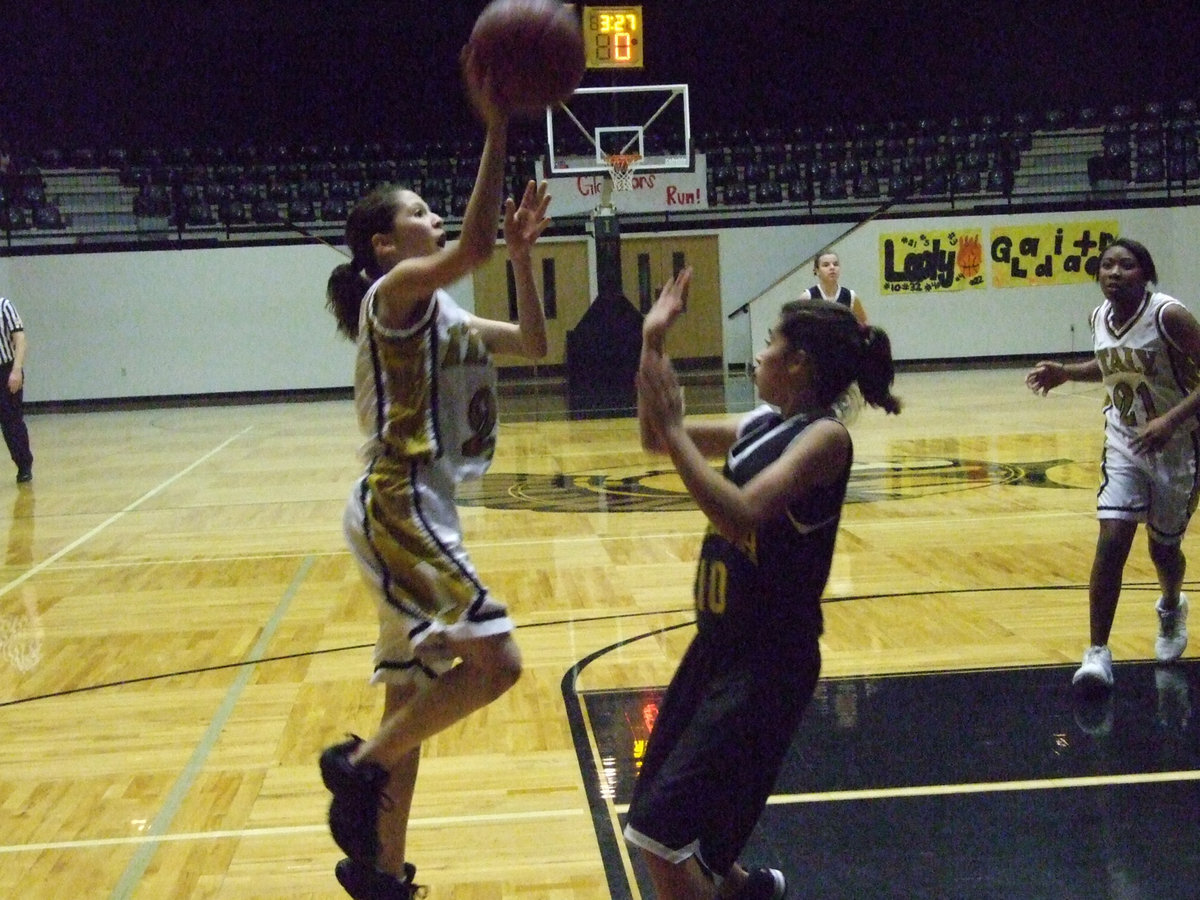 Image: Paola Mata  — Italy’s #2 Paola Mata scores again leaping toward the basket.