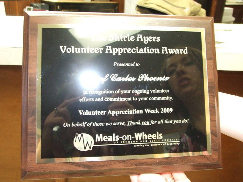 Image: Volunteer Appreciation Award — Mr. Shirle Ayers Volunteer Appreciation Award that was presented to Milford Police Chief Carlos Phoenix.