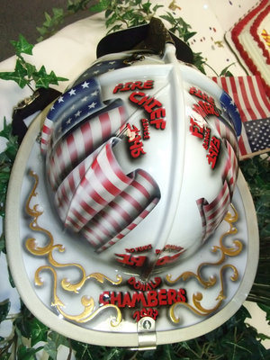 Image: What a gift — Chief Chambers was given this helmet by members of the Italy Fire Department when he celebrated his 30th year of serevice.