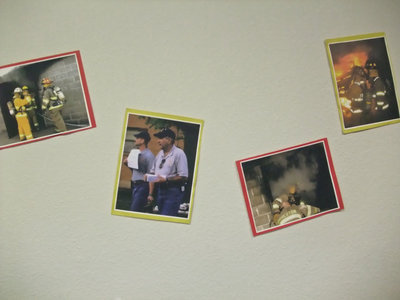 Image: The wall of flame — Chief Chambers with pictures of his crews in action decorated the Council Chamber’s walls during the reception.