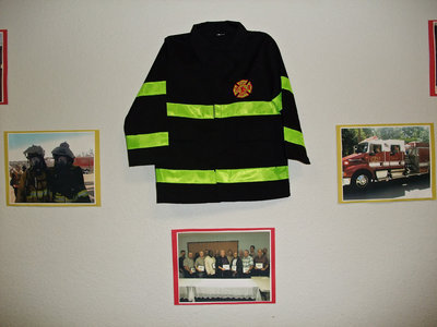 Image: Don’s first fire coat — Memories were everywhere in the Italy City Council Chambers as Fire Chief Don Chambers officially retired from city service. That’s not really Don’s first coat.