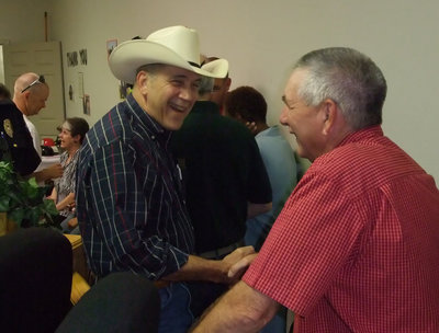 Image: Larry thanks Don — "That away to “cowboy up” Chief!" Larry Norcross thanks Don for his 37 years of service and congratulates him on his retirement.