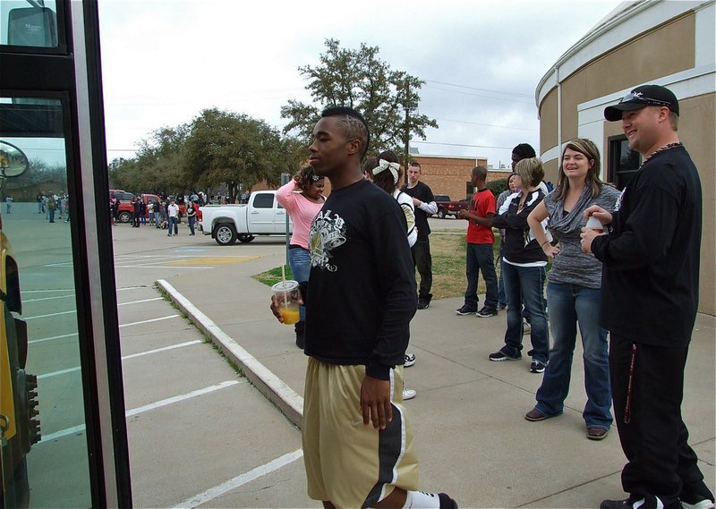 Image: They’ve Awakened the “Beast” — Jasenio Anderson boards the bus with a morning orange juice in hand.