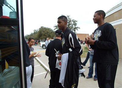 Image: Here we go — Devonta Simmons and Larry Mayberry exit the Italy Coliseum dome and then make their way onto the bus.