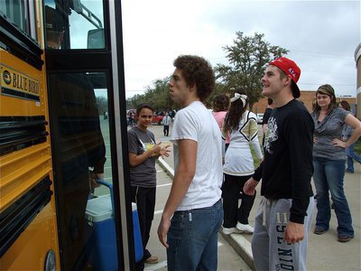 Image: Snoop’s driving? — Gladiators Brandon Souder and Ryan Ashcraft board the bus-like chariot with some apprehension.