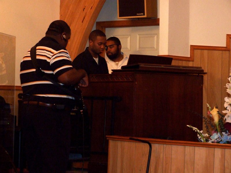 Image: Musicians Warming Up — Musicians from Carver Heights Baptist Church getting ready to play.