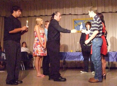Image: Pass the torch — NHS officers for 2009 pass the torch to the new officers for 2010. New officers are Jessica Hernandez-President, Shelby Gilley-Vice President, Molly Haight-Secretary, Ryan Ashcraft-Treasurer and Kelli Strickland-Reporter.