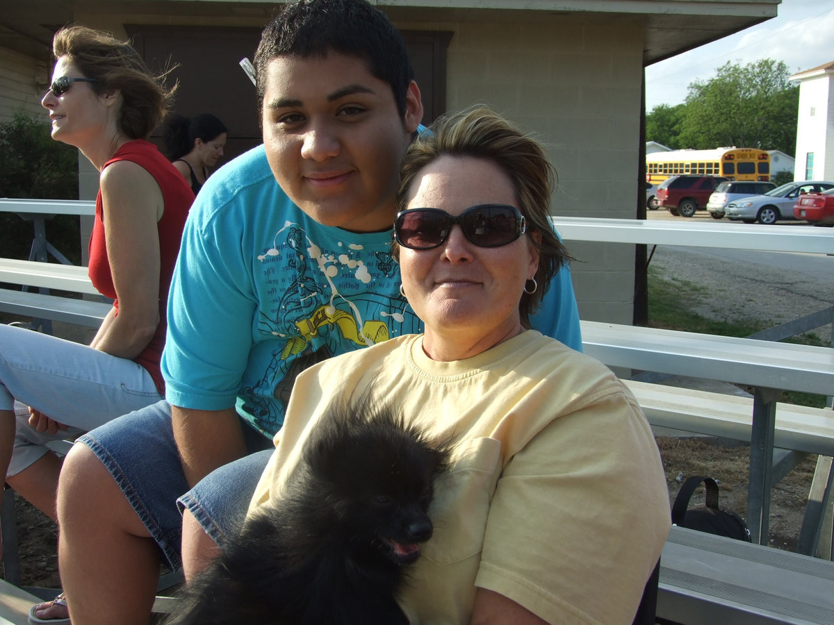 Image: Alonzo Ayalla and Mrs. Cochran — Junior Alonzo Ayalla, Mrs. Cochran and friend, Bucky, enjoy the afternoon game in Avalon.