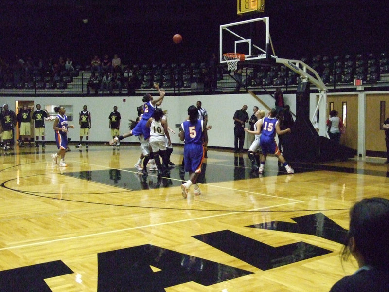 Image: Leapfrog in the paint — A Lady Gator of Gateway leapfrogs over Marisela Perez in the paint.