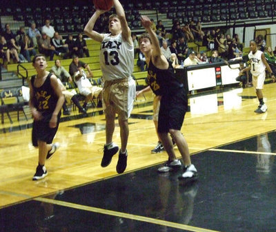 Image: Wood from the block — Justin Wood #13 goes up for 2-points in the paint.