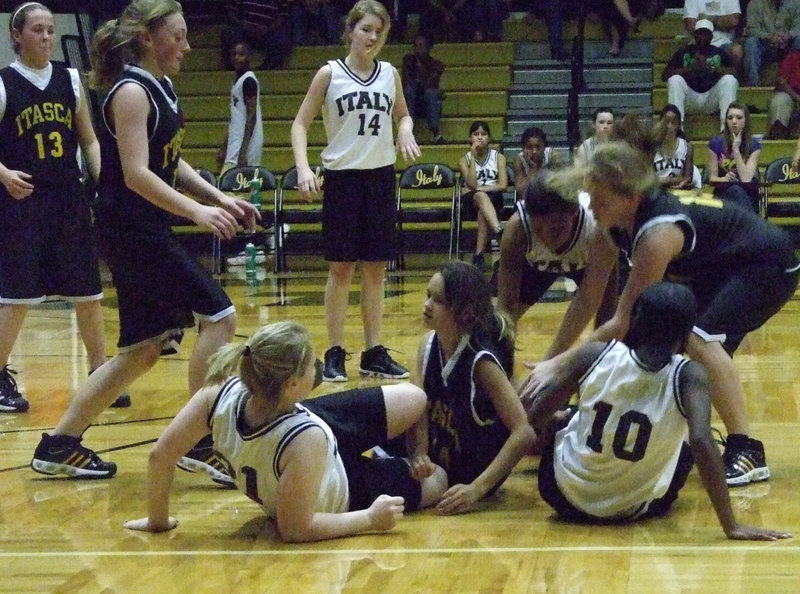 Image: All on the floor — Italy’s 7th grade girls leave it all out on the floor but can’t come up with a win against Itasca.