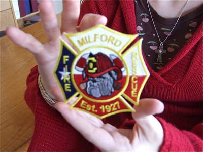 Image: Milford Fire patch — Cheyenne proudly displays her handy work.