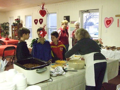 Image: Youth enjoys supper — Local youth stopped in on Saturday night to get a big bowl of chili.
