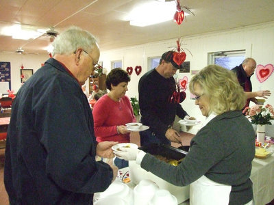 Image: Local Methodists eat — Kenneth Crowell gets his chili from Jan.