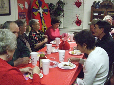Image: Local patrons enjoy — About 40 people took time to enjoy conversation, hearts and flowers Saturday night.