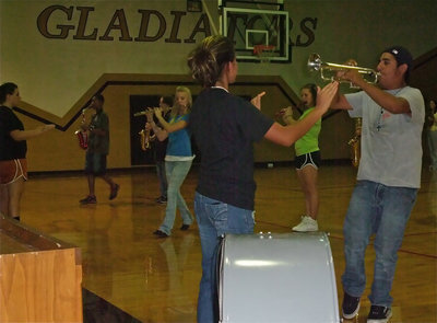 Image: Gladiators march in — Molly and Jessica keep the band members in rhythm.