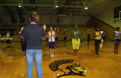 Image: Jessica conducts band — Jessica conducts the band as they practice in the old Italy gymnasium.