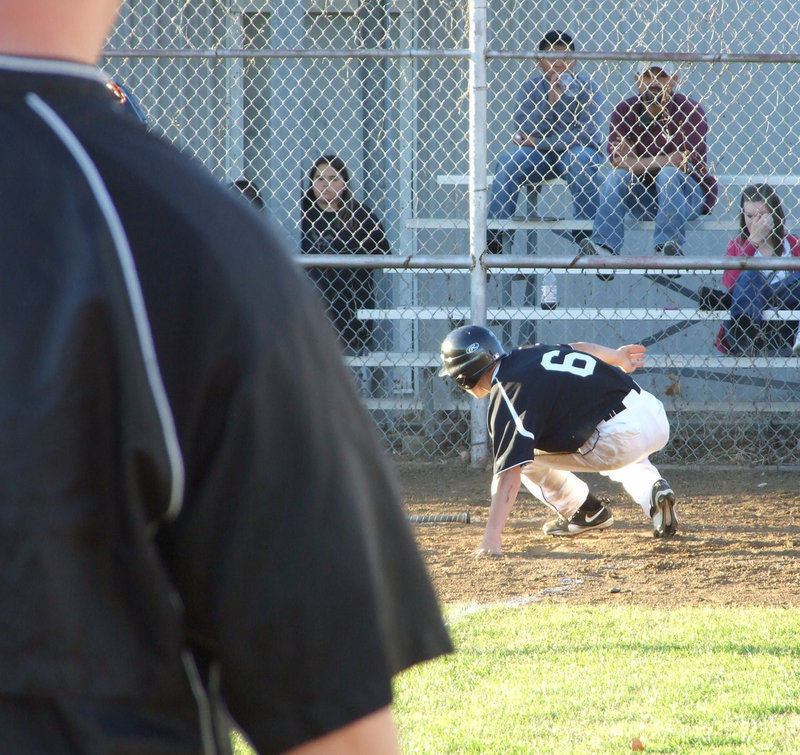 Image: And then he’s home — Coach Ward watches Tony put another score on the board.