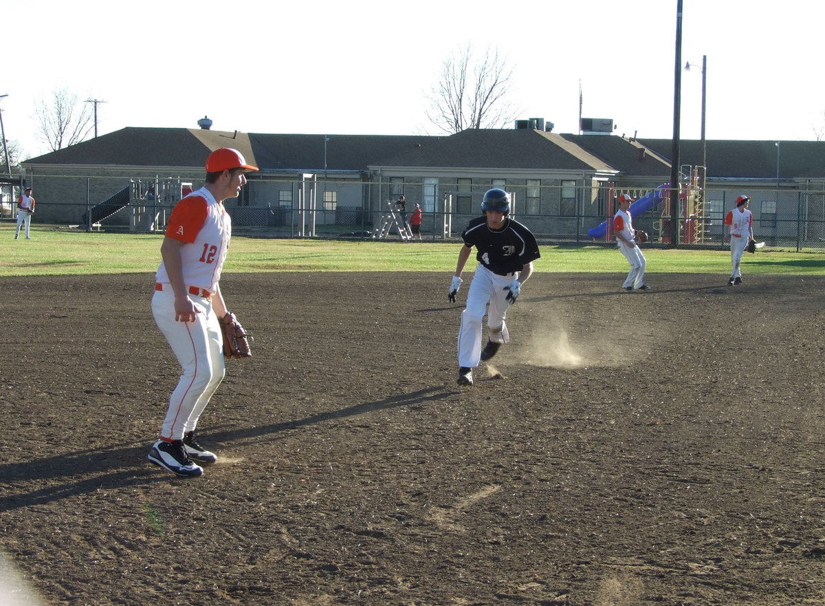 Image: DeMoss running to 3rd — Alex DeMoss runs safely to 3rd.